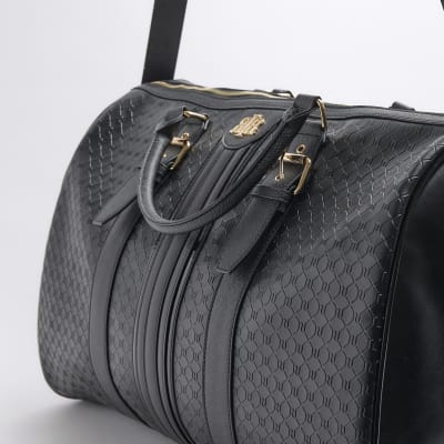 Black large embossed RI monogram travel bag River Island