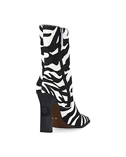 360 degree animation of product Black leather animal print heeled ankle boots frame-11