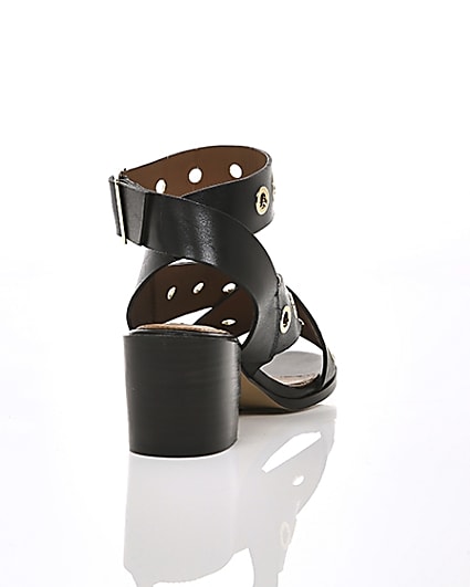 360 degree animation of product Black leather eyelet block heel sandals frame-14