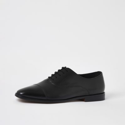 black leather heeled brogues