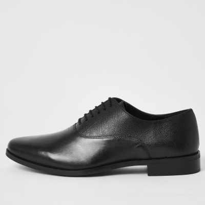 mottle leather flat brogues in black
