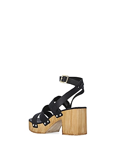 360 degree animation of product Black leather platform heeled sandals frame-6