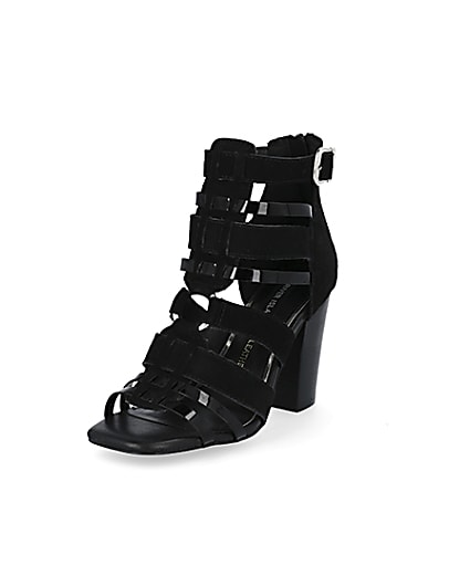 360 degree animation of product Black leather strappy heeled sandals frame-0