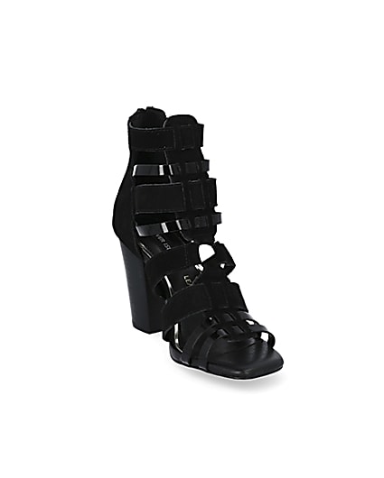 360 degree animation of product Black leather strappy heeled sandals frame-19