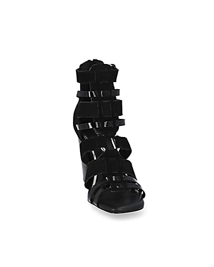 360 degree animation of product Black leather strappy heeled sandals frame-20