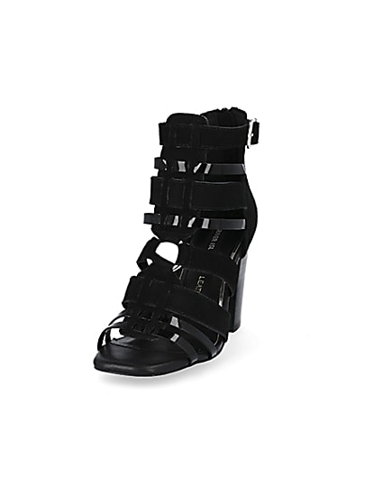 360 degree animation of product Black leather strappy heeled sandals frame-23