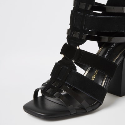 Black leather strappy heeled sandals