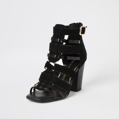Black leather strappy heeled sandals