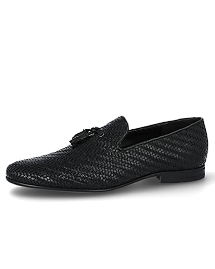 360 degree animation of product Black leather textured tassel loafers frame-2