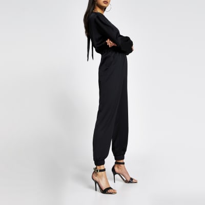 Black long sleeve elasticated waist jumpsuit River Island