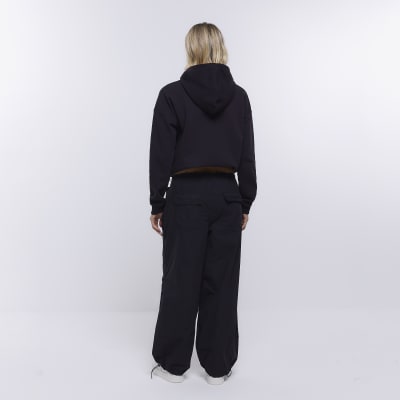 Black low rise parachute trousers