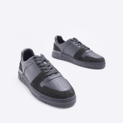 Black low top trainers