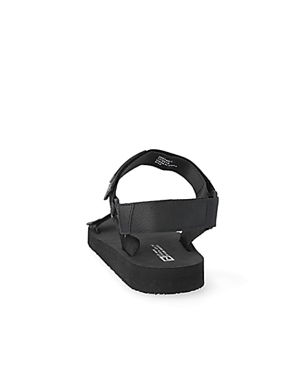 360 degree animation of product Black 'LVII' velcro strap sandals frame-8