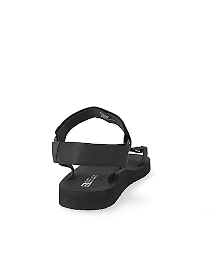 360 degree animation of product Black 'LVII' velcro strap sandals frame-10