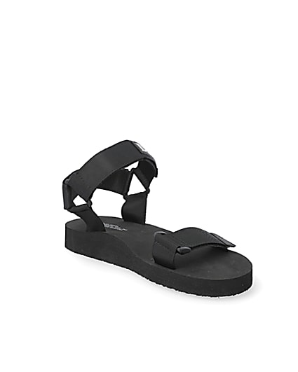 360 degree animation of product Black 'LVII' velcro strap sandals frame-18