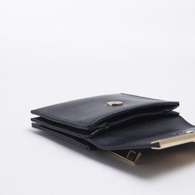 Black mini folder over purse