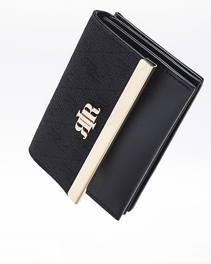 Black mini folder over purse