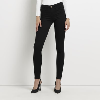 Black Molly low rise bum sculpt skinny jeans | River Island