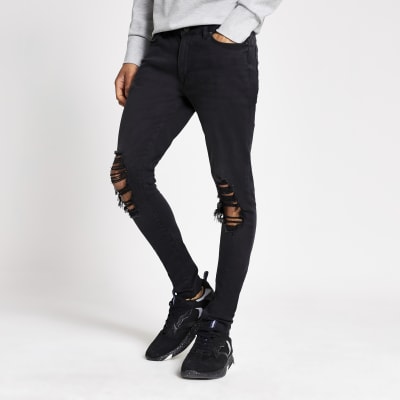 Black Ollie spray on skinny ripped jeans River Island