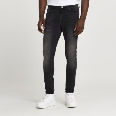 Black Ollie super skinny spray on jeans | River Island