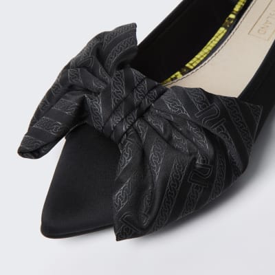 Black oversized bow flat shoes