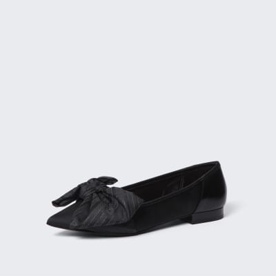 Black oversized bow flat shoes
