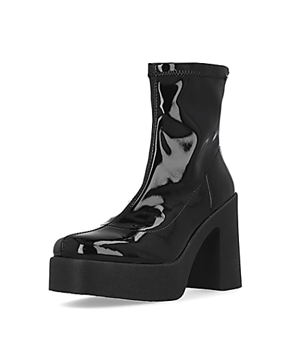 360 degree animation of product Black patent heeled biker boots frame-0