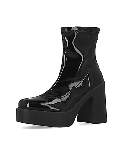 360 degree animation of product Black patent heeled biker boots frame-1