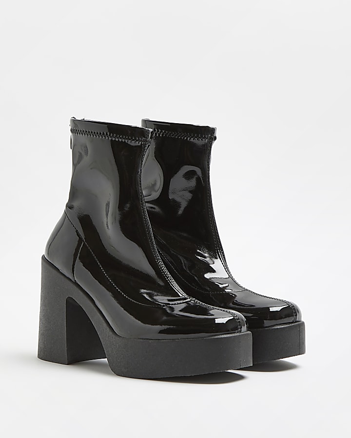 Black patent heeled biker boots