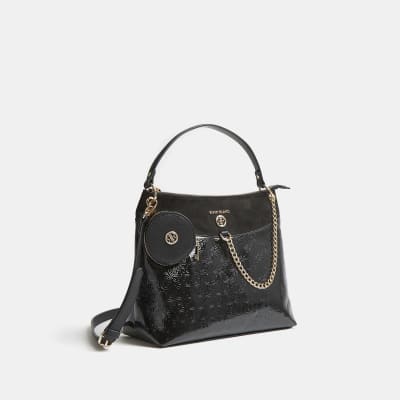 Black patent RI monogram embossed slouch bag | River Island