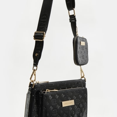 Black patent RI monogram messenger bag River Island