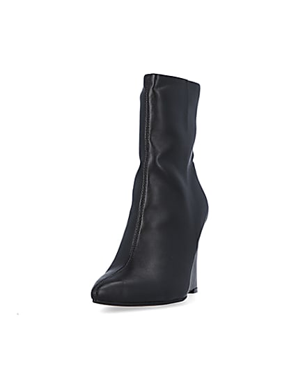 360 degree animation of product Black pointed toe wedge ankle boots frame-23