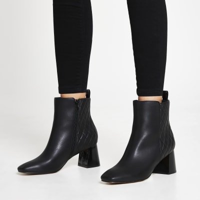 Black quilted block heel boots