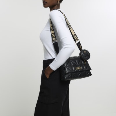 Black quilted cross body bag River Island