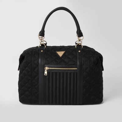 Black quilted cross body weekend bag | River Island