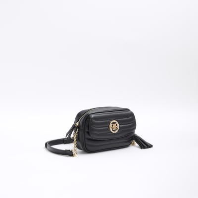 Black quilted flap front cross body bag River Island
