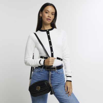 Black quilted flap front cross body bag River Island