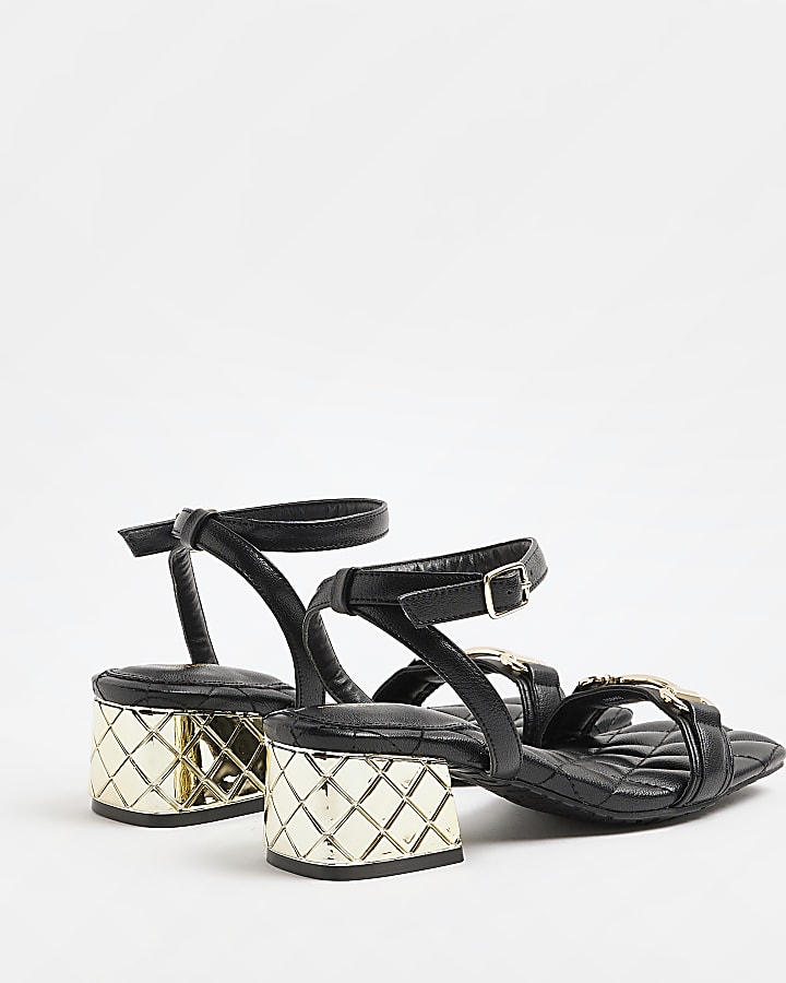 Black quilted heeled sandals