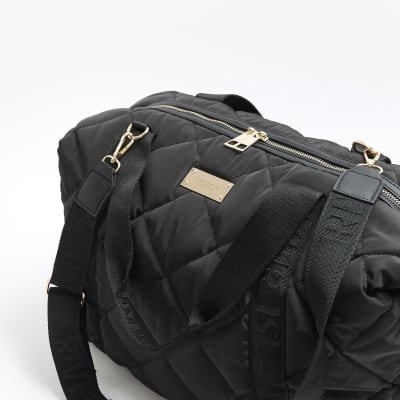 Black quilted webbing travel bag River Island