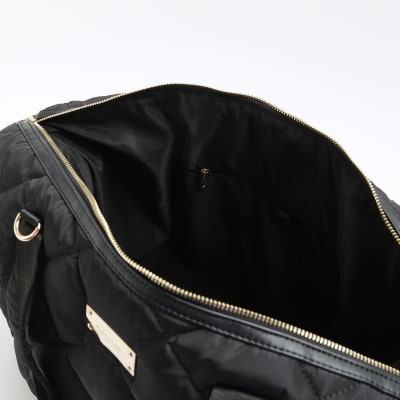 Black quilted webbing travel bag River Island