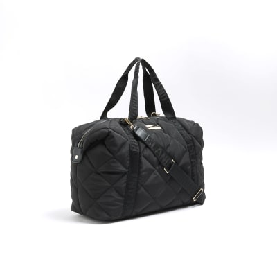 Black quilted webbing travel bag River Island