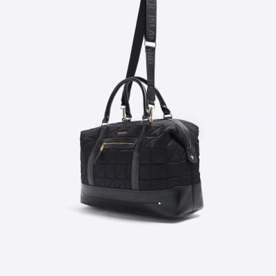 Black quilted zip travel bag River Island