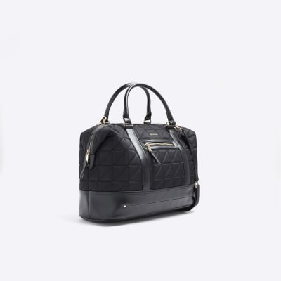 Black quilted zip travel bag River Island