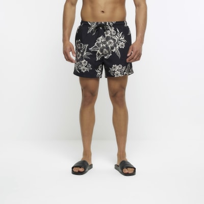 Black regular fit floral swim shorts | River Island