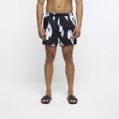 Black regular fit floral swim shorts
