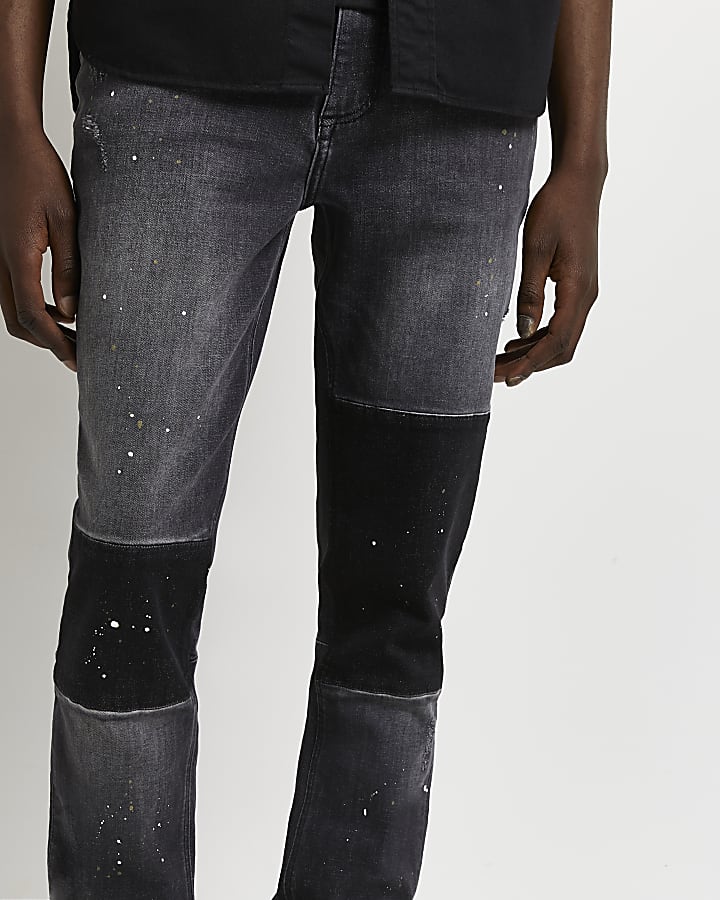 Black relaxed skinny fit patchwork jeans