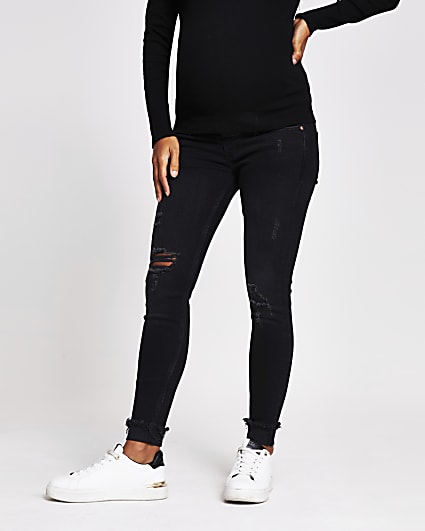 Black ripped mid rise maternity skinny jeans