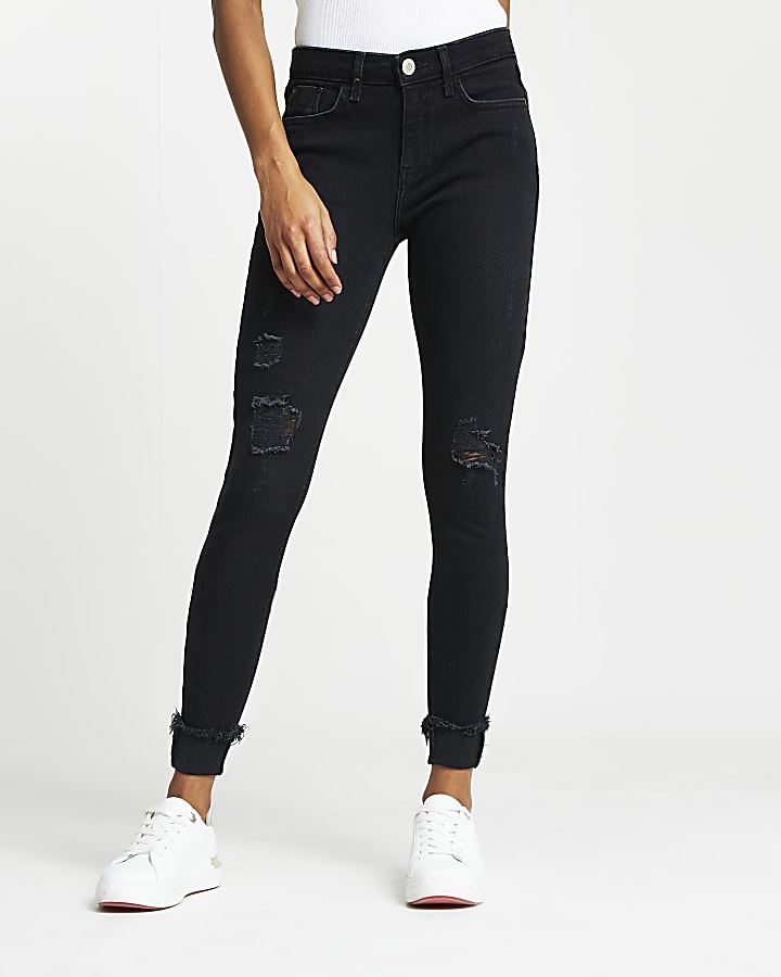 Black ripped mid rise skinny jeans