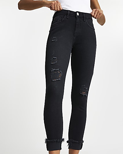 Black ripped mid rise skinny jeans