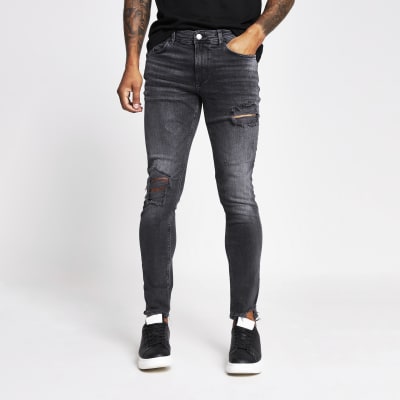 black ripped skinny jeans river island